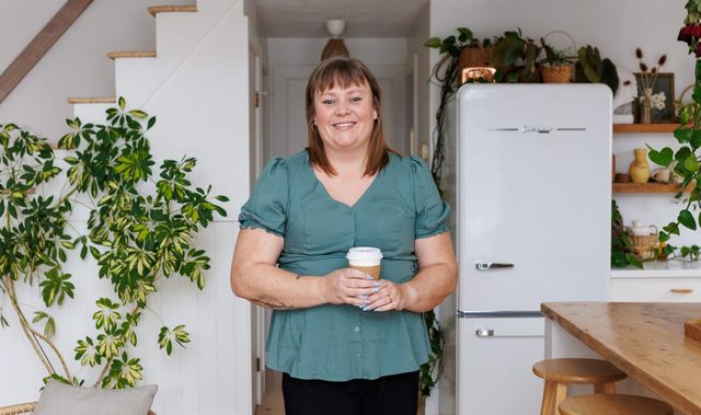 Mary-Jane Wells standing outside a home she has listed
